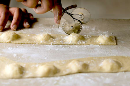 cutting homemade ravioli pasta