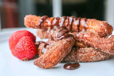 homemade churros with chocolate sauce