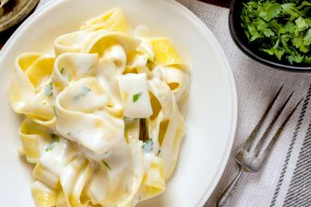 homemade pappardelle pasta with alfredo sauce