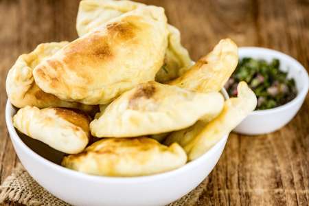 homemade vegetarian empanadas with sauce