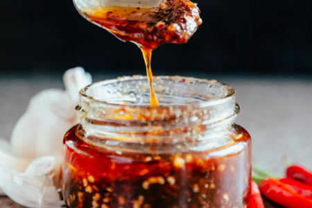 hot sauce in a spoon and in a jar