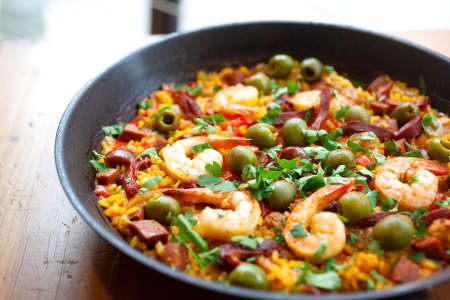 paella with seafood, chicken and olives