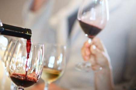 pouring red wine for a wine tasting class