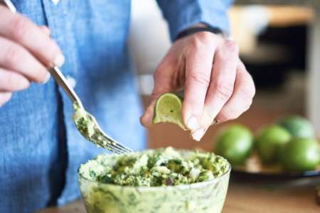 preparing guacamole from scratch