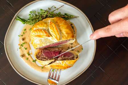 slicing into beef wellington