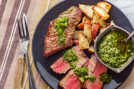 steak with chimichurri and red potatoes