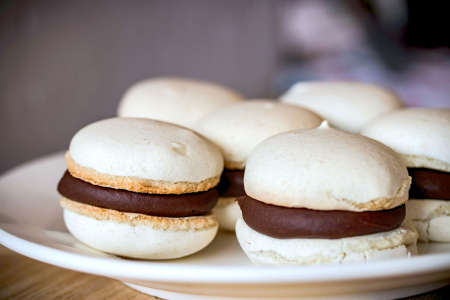 vanilla macaron shells with chocolate ganache