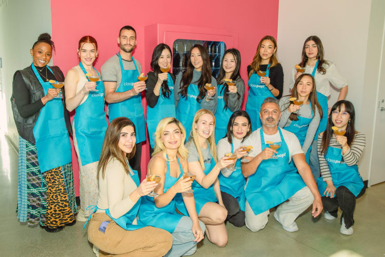 Team raising glasses after a mixology event in NYC