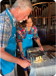 olling pasta with help from the instructor