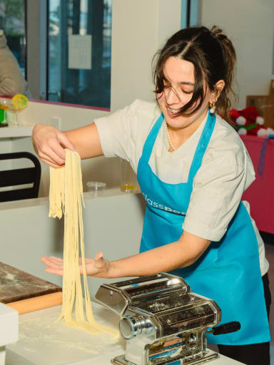 Guests laughing while cooking