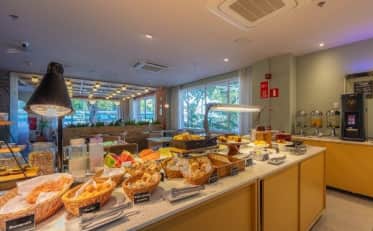 Rich breakfast buffet with fresh pastries and fruit at B&B HOTEL restaurant