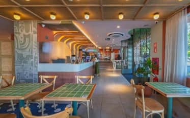 Modern B&B HOTEL lobby area with stylish seating and reception desk in a contemporary design setting