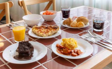 Delicious breakfast buffet with quiche and scrambled eggs at B&B HOTEL