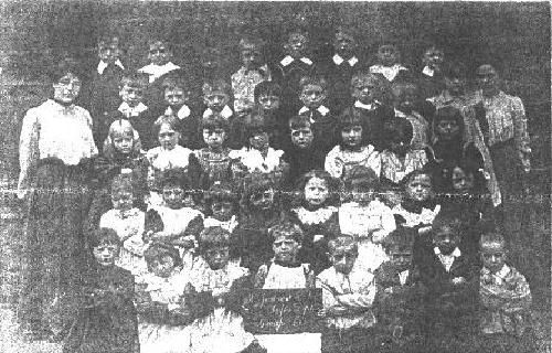 Mytholm School group with Miss Agnes Helen Cobbe, Pupil Teacher (about 16 years old) 1896