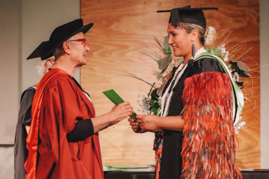 University graduate being congratulated