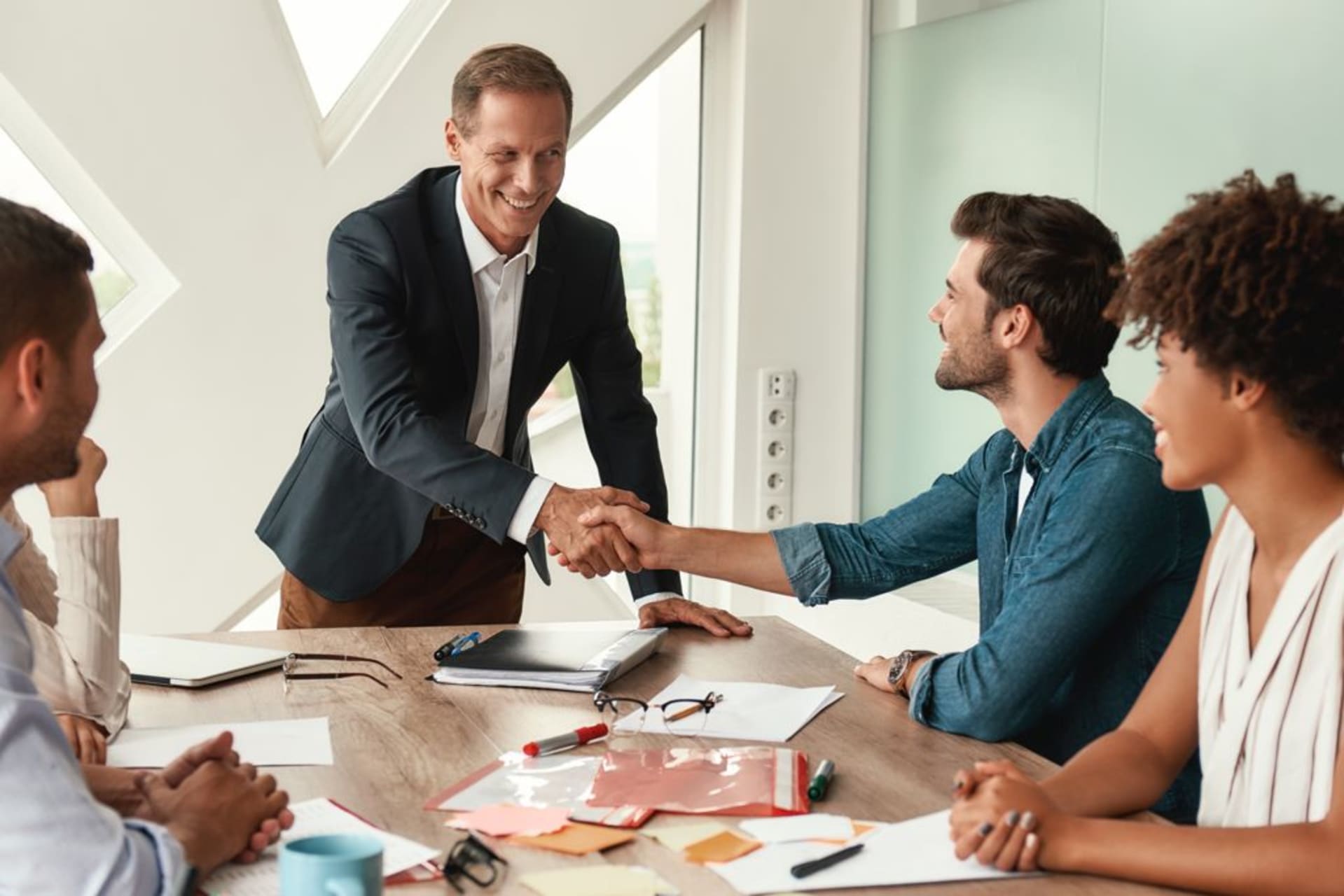Business people shaking hands after making a deal
