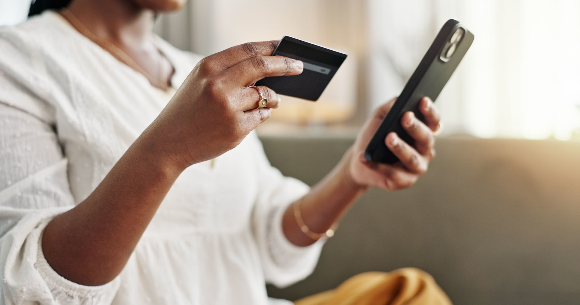 Woman shopping on phone with credit card