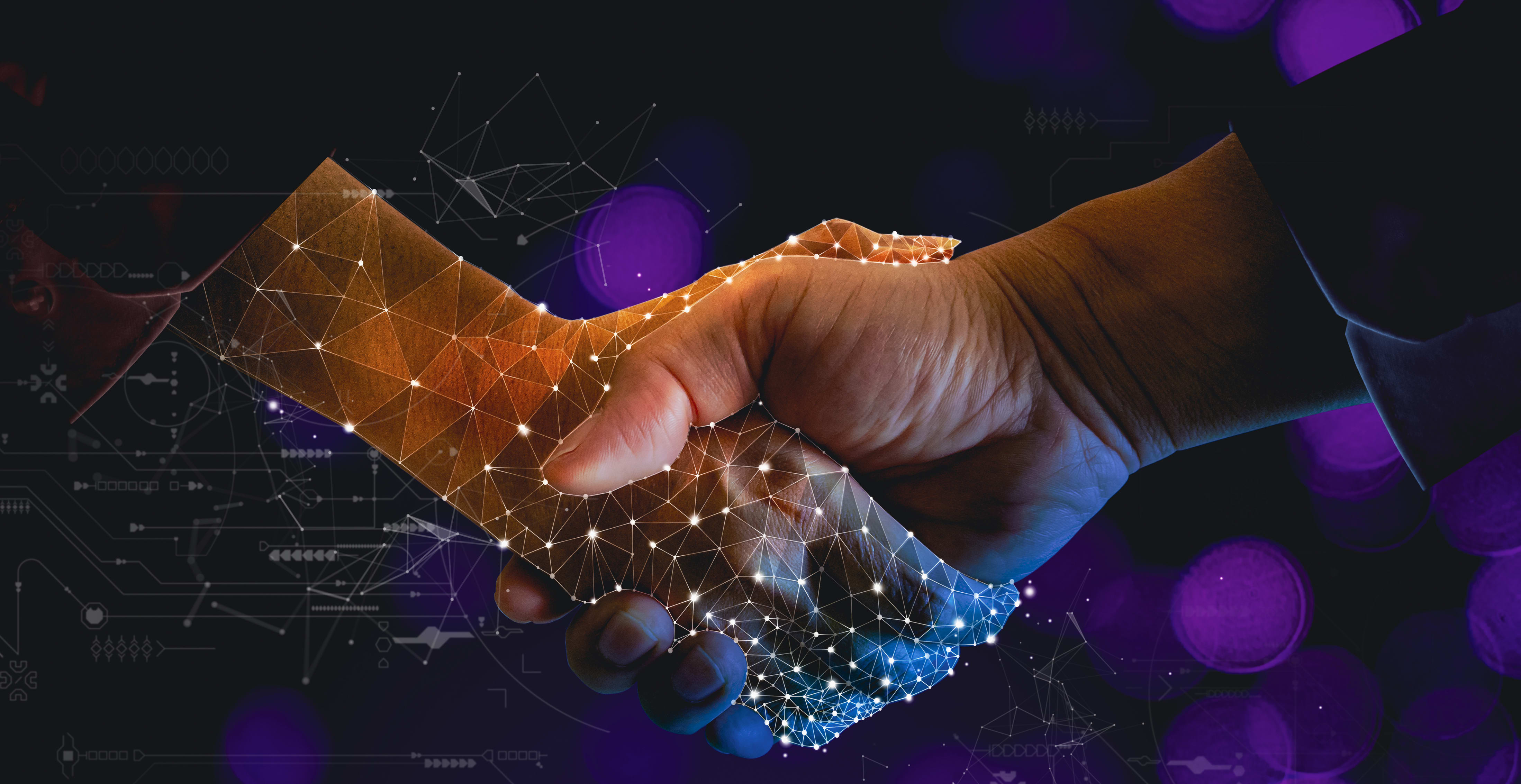 Human hand shaking holographic hand