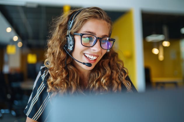 Smiling customer support woman on headset