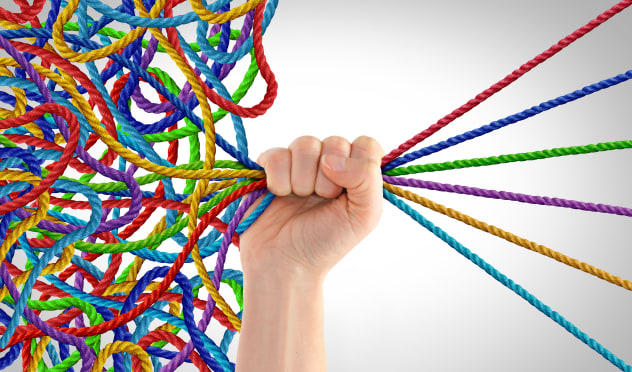 Hand organising coloured ropes