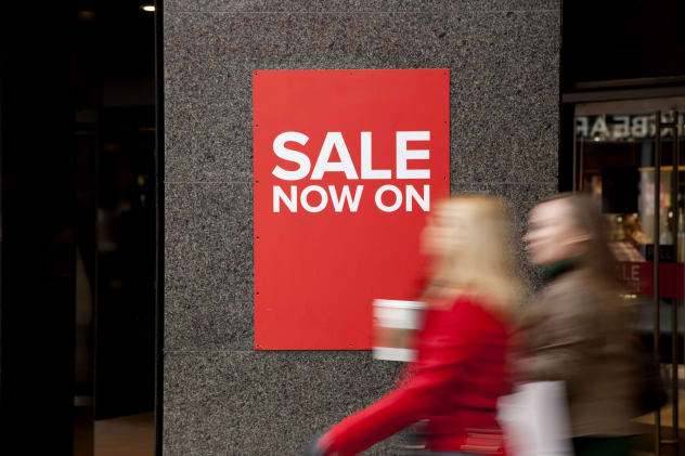 Sign saying "Sale on now" in shop window