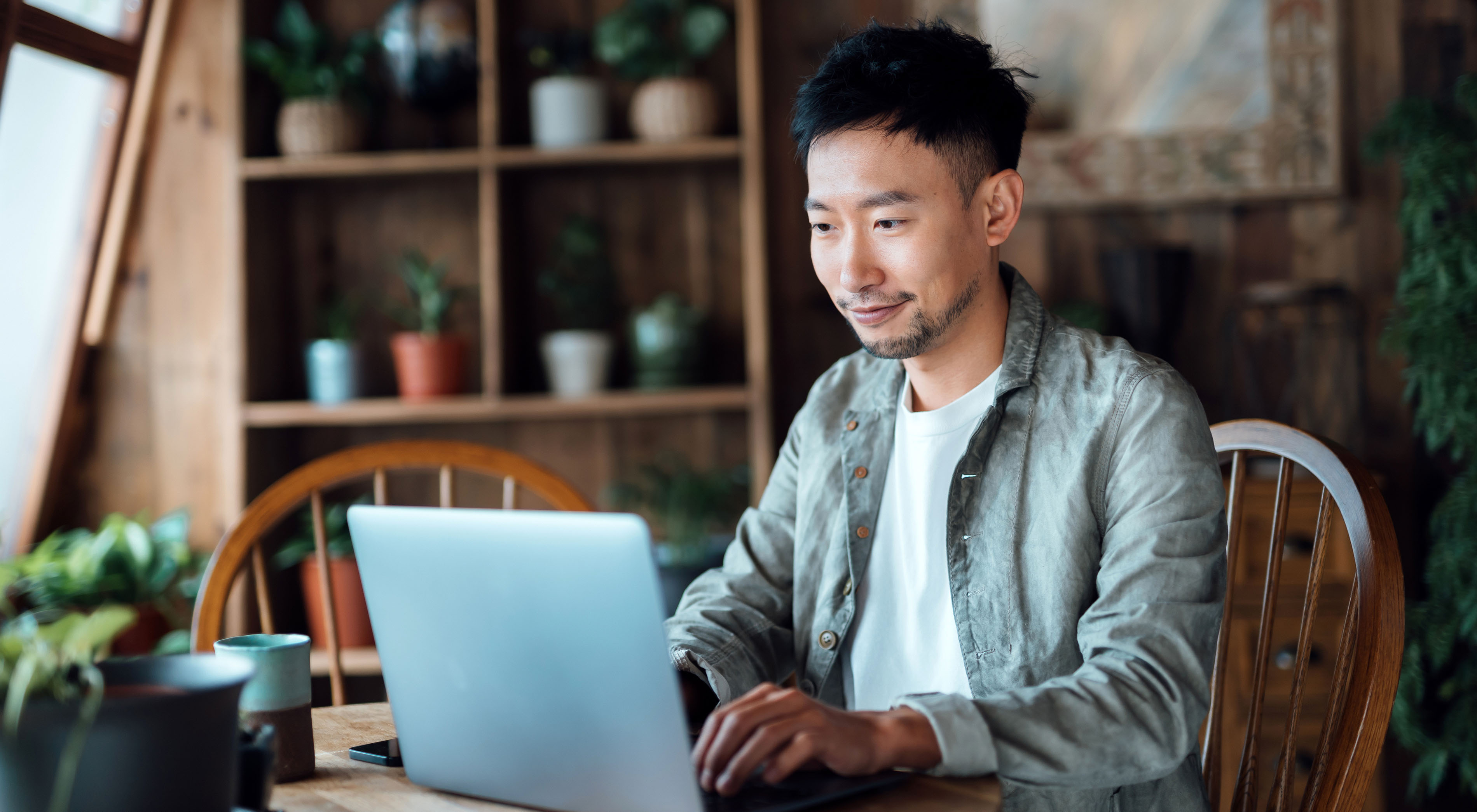 Young man online shopping on laptop form home