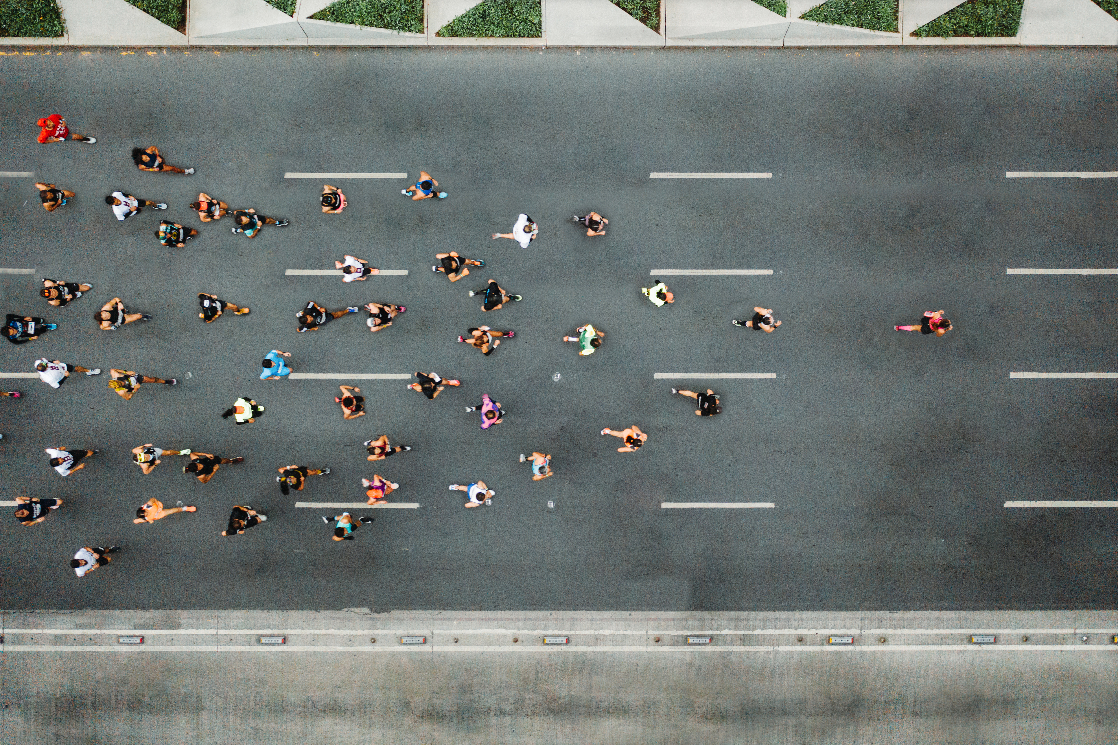 Joggers from above running behind leader