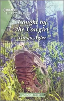 Book cover of Caught by the Cowgirl