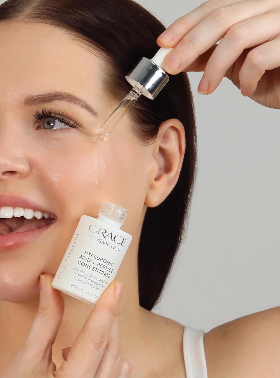 Person applying Hyaluronic Acid + Peptide Concentrate on face