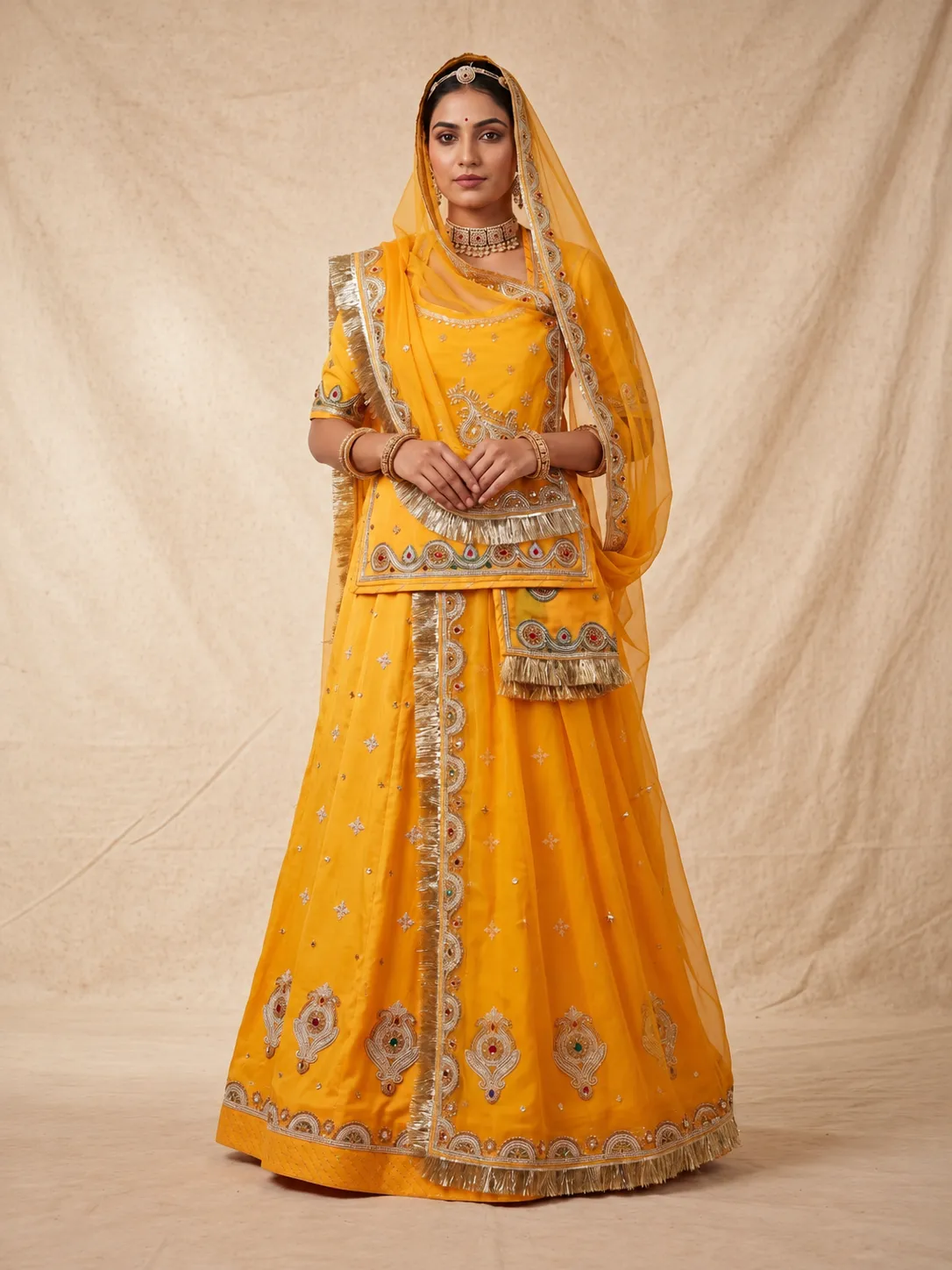 Kesariya Sunehri Poshak Rajputi poshak – Georgette with Heavy Kundan Work