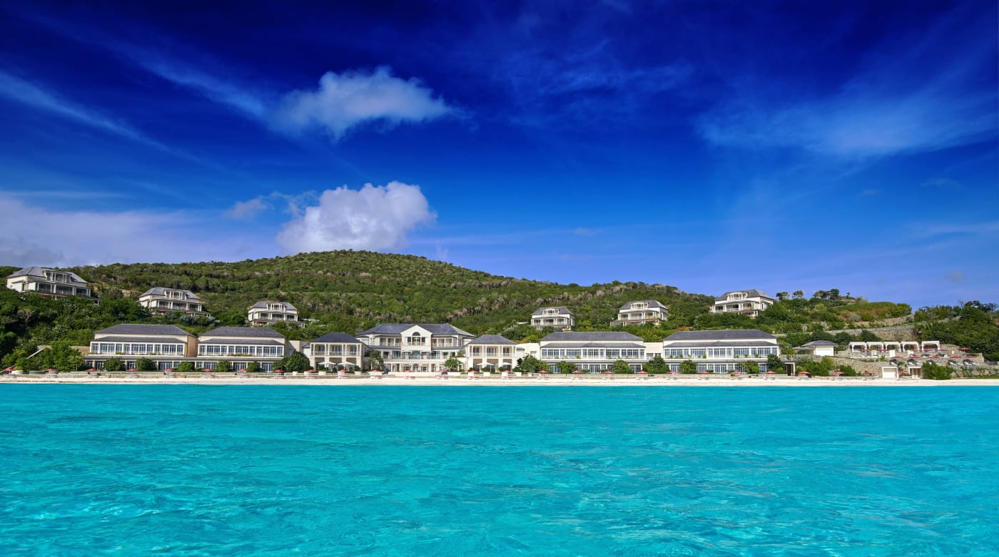 As suítes em estilo colonial do Mandarin Oriental, Canouan vistas da lagoa azul-turquesa