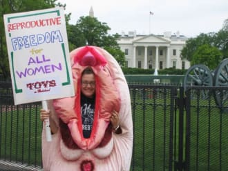 Founder Claire Cavanah petitions for reproductive rights in front of the White House while dressed in a vulva costume.