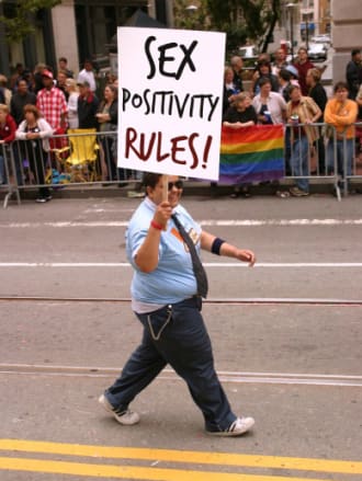 Andy at age 20, marching with Good Vibes in SF Pride parade