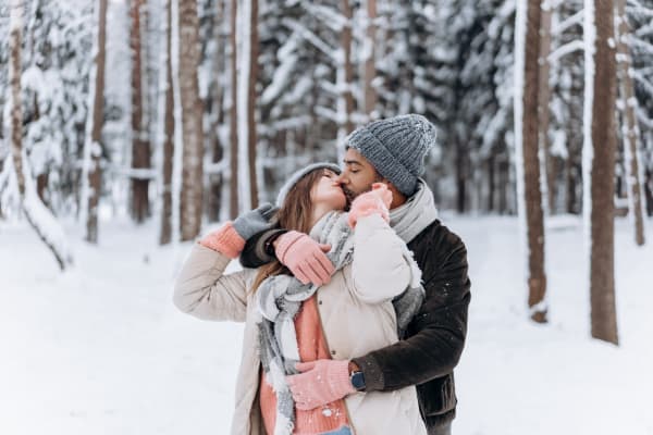 male and female couple in winter wonderland
