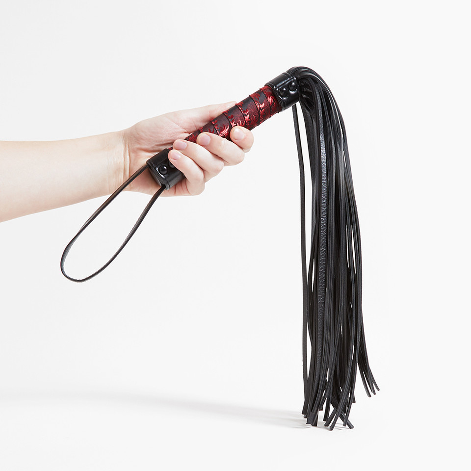 Scandal Flogger held in hand