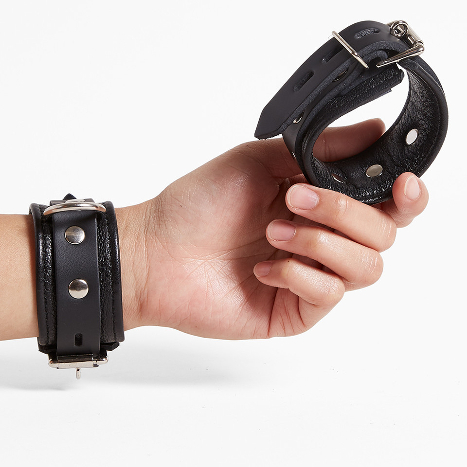 Cumfy Cuffs worn and held in hand