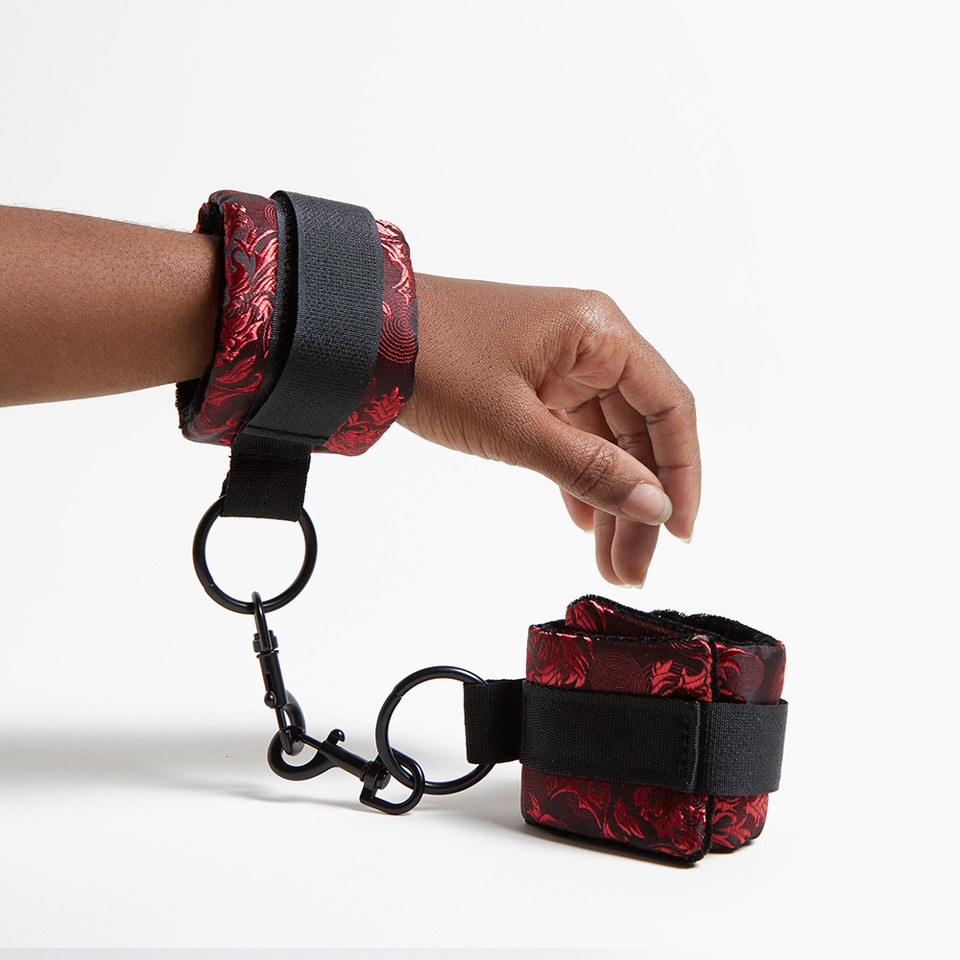 Scandal Universal Cuffs worn and held in hand