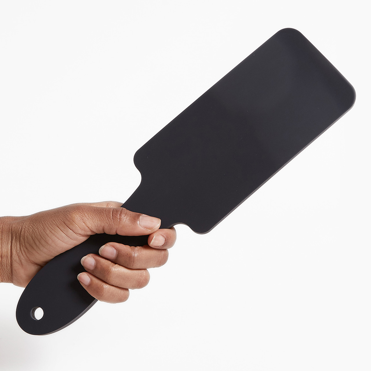 Tantus Thwack Silicone Paddle held in hand