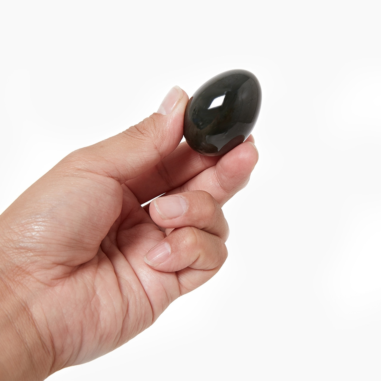 Hand holding Chakrubs Jade Yoni Egg