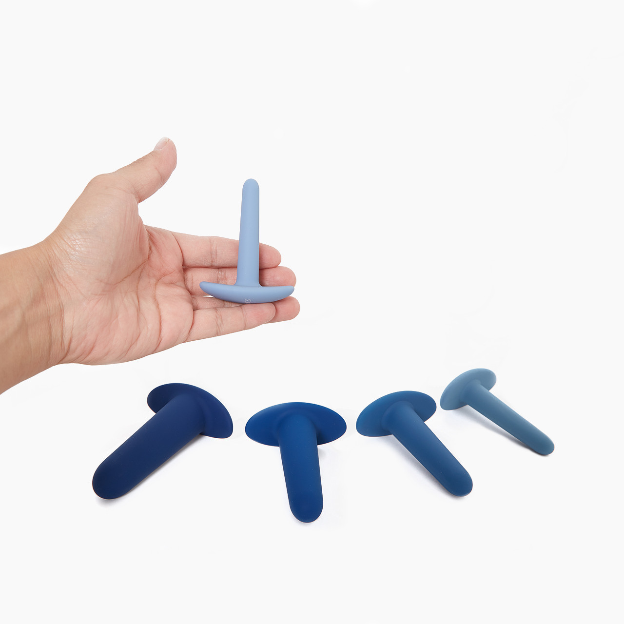 They-ology 5-Piece Anal Training Set with size 1 held in hand