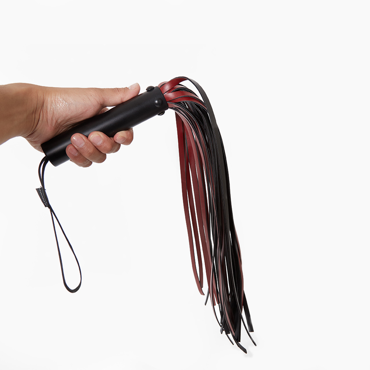Sportsheets Saffron Flogger held in hand
