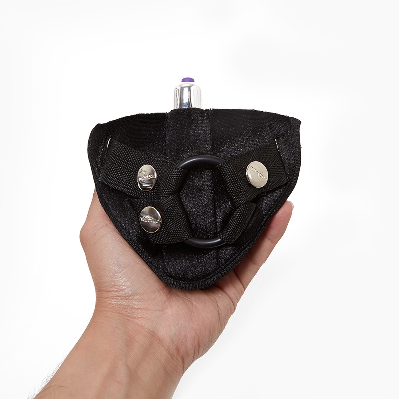 Tantus Vibrating Harness held in hand