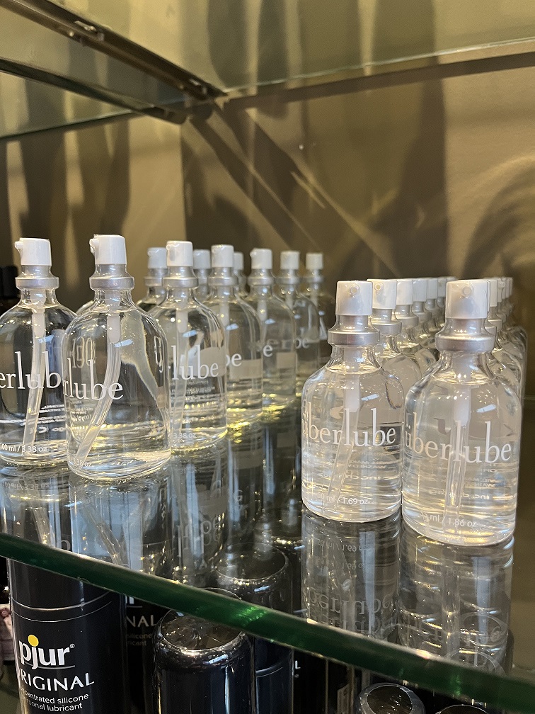 Uberlube sitting on a glass shelf