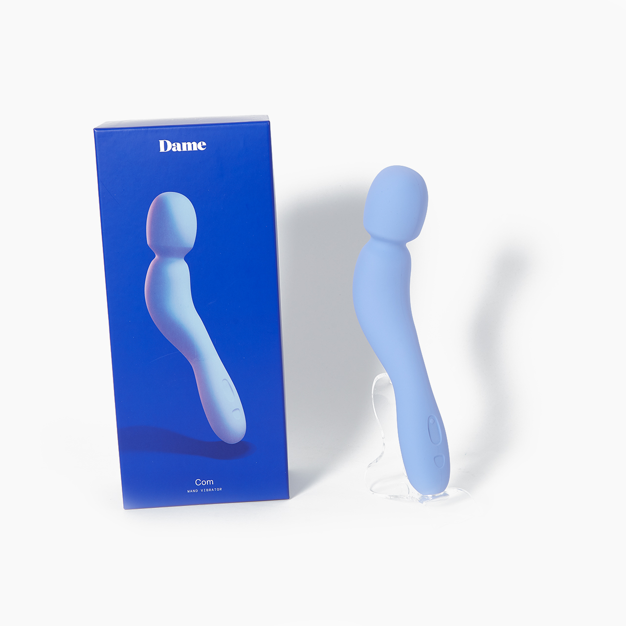 Dame Com Wand Vibrator with Body Safe Silicone next to packaging