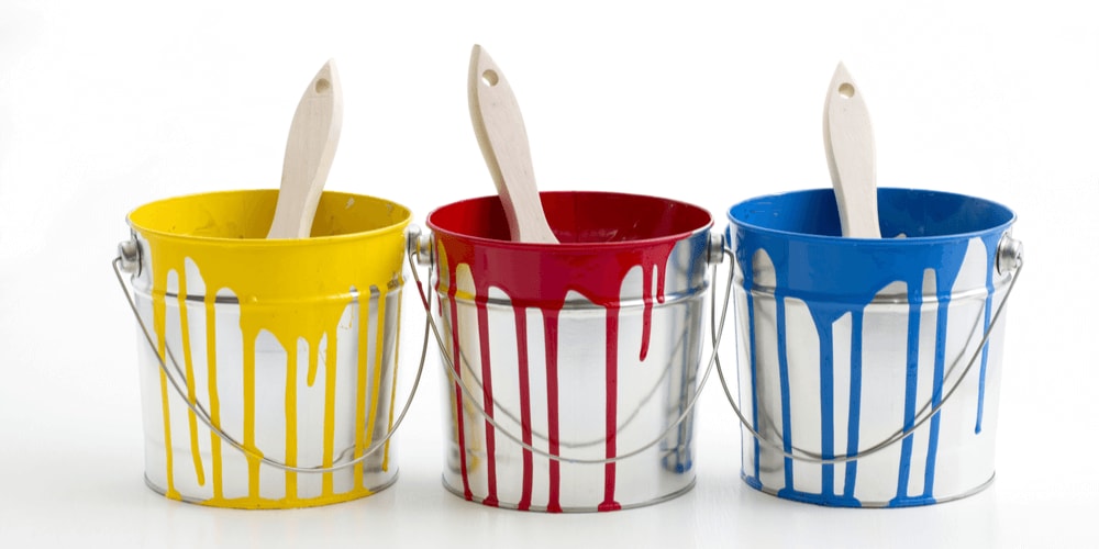 Primary color paints in buckets - color your life!