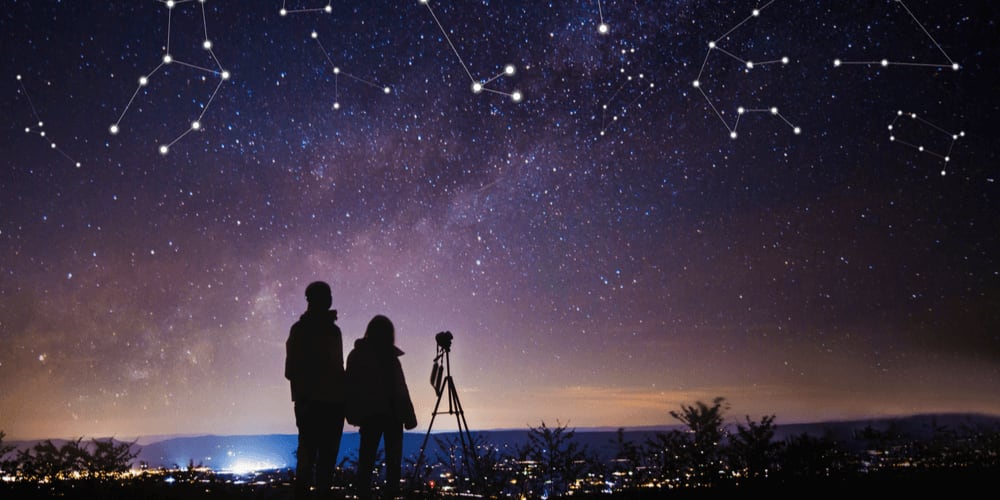 Young couple looking in the sky