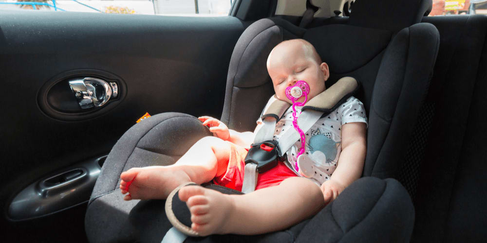 Baby in a car in summer
