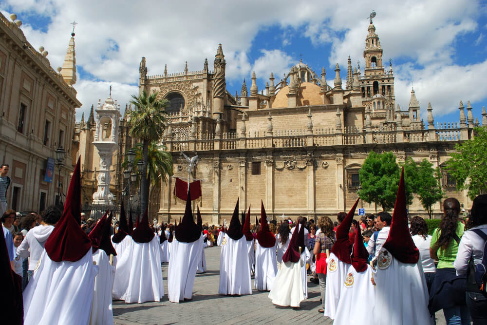 Group of penitentes in front of the Seville Cathedral