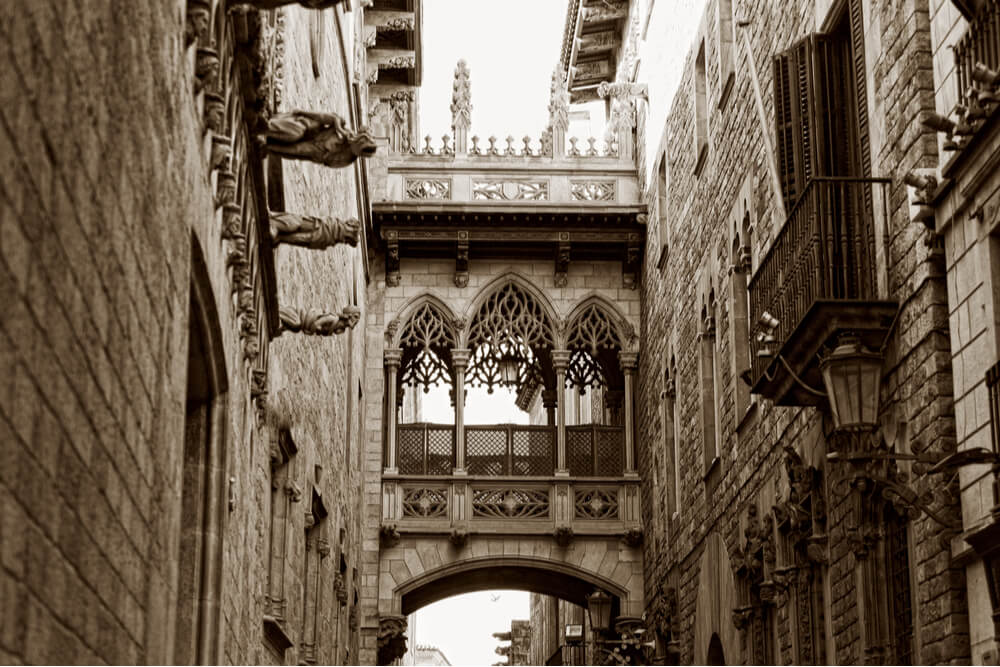 Covered bridge between two buildings in the Gothic Quarter.