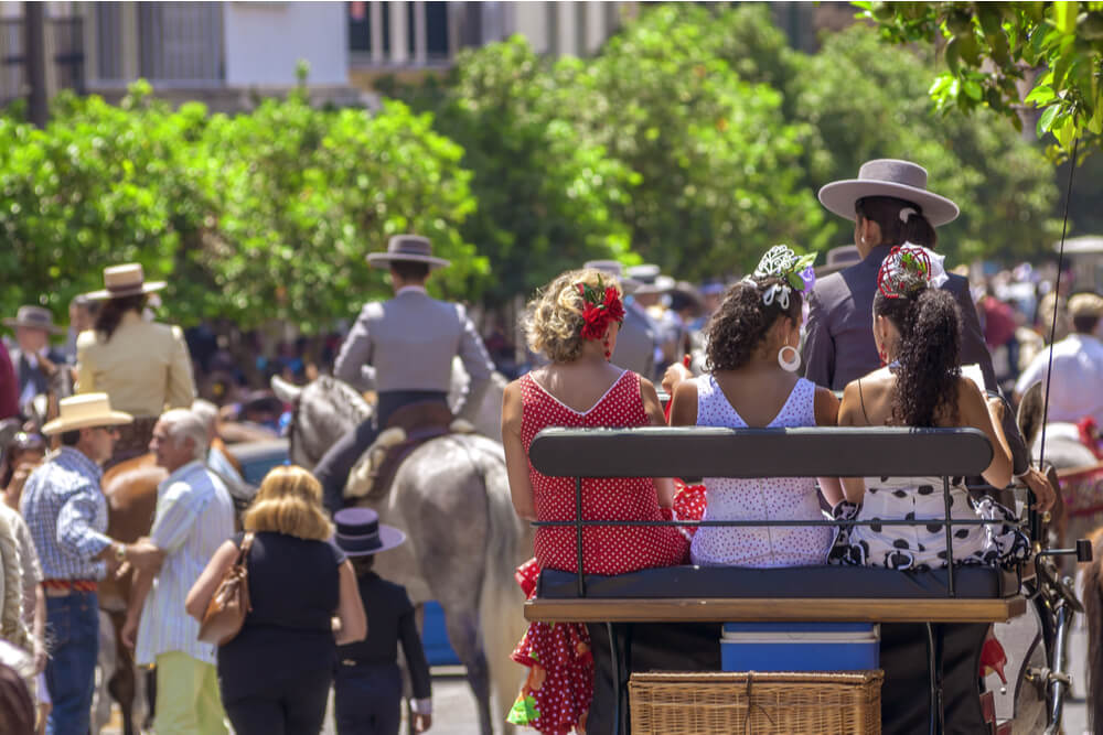 A horse cart carrying passengers during Feria de Málaga.